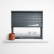 Ventana con persiana metálica a medio bajar, revela un paisaje urbano suave; ideal para explorar opciones de persianas en Hospitalet.